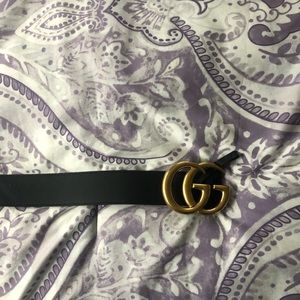 Black and gold Gucci belt